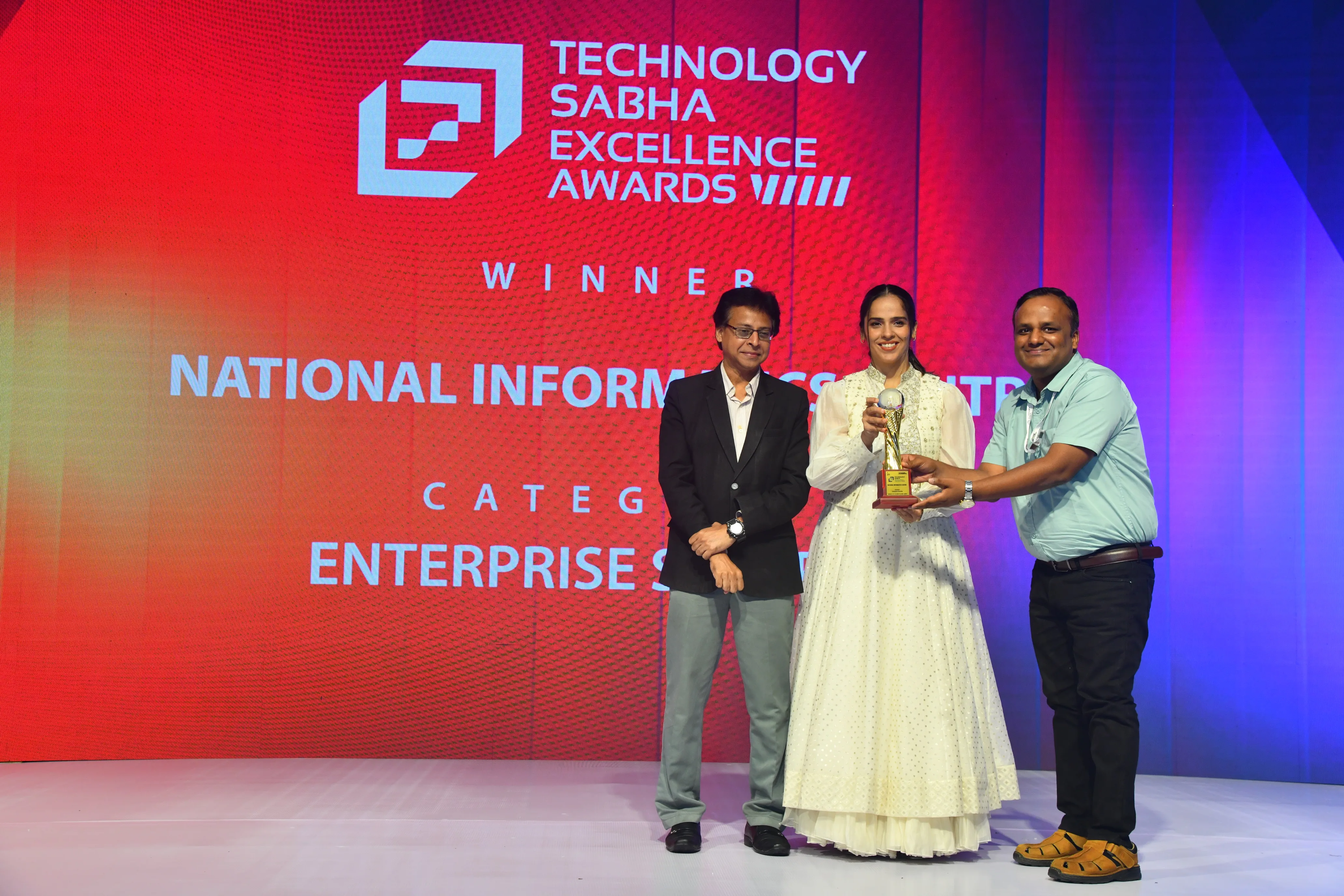 Sarvagya wins Enterprise Security award at Technology Sabha 2026, trophy presented by Saina Nehwal to National Informatics Centre